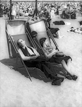 A Couple Sleeps At The Beach