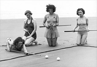 Four Girls Playing Sand Pool