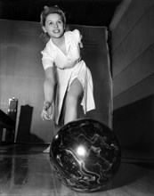 A Young Woman Bowling