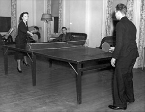 Two students playing ping-pong in the recreation hall at Columbi