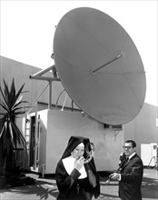 Nun Listens To Satellite