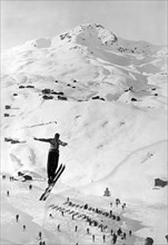 Skier Leaping Over A Valley