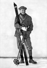 A Man Poses With Skis