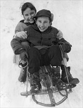 Happy Children On A Sled