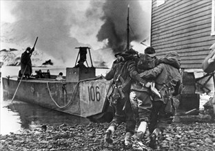 A wounded British Commando is being evacuated after a raid on German suppy depots in Norway.