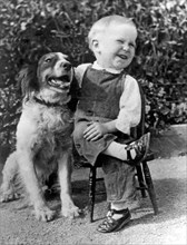 A Boy Laughs With His Dog