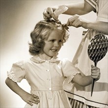 A Young Girl Gets A Bow