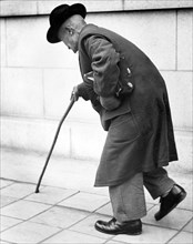 Old Man Walking With A Cane