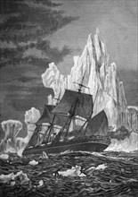 Sailing ship facing an iceberg