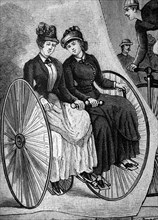 Women riding a tricycle