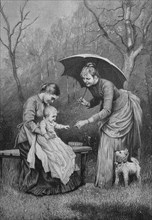 Mother with aunt and a child in a garden