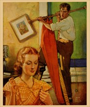 Wife sews while a man hangs a picture 1936