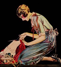 Woman cuts a dress patter with her scissors 1925