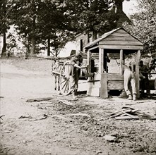 Fredericksburg, Virginia. Soldiers drawing water from a well. Army of the Potomac 1864