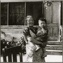 Grandmother Hold Baby in evacuation to Manzanar 1942