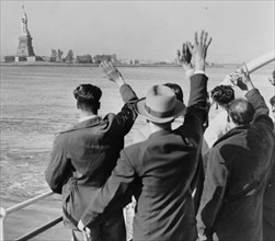 Deported Group Waves Goodbye to the Statue of Liberty 1952