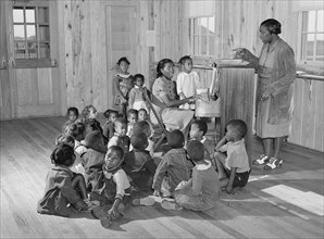 Singing and music for agricultural workers' children in new day nursery at Okeechobee migratory labor camp. 1941