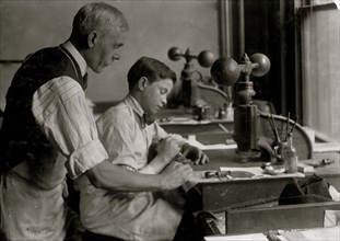 14-year old Fred cutting dies for Embossing shop  1917