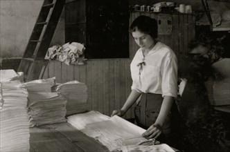 Folding towels in Bonanno Laundry. 1917