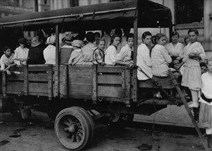 6:00 A.M. at Post Office Square. Truck load of tobacco workers bound for American Sumatra Tobacco Farm, 1917
