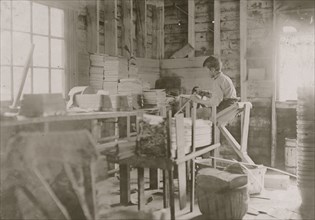 A Basket Factory, Evansville, Indiana. Boy Making Melon Baskets 1908