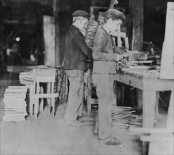 A Basket Factory. Boys making grate bottoms. 1908