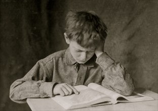 A Boy Reads a Book and Studies 1924