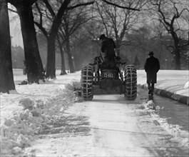 A Ford Tractor cleans snow on DC Street 1924