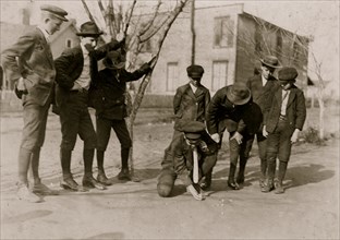A quiet game of marbles.  1909