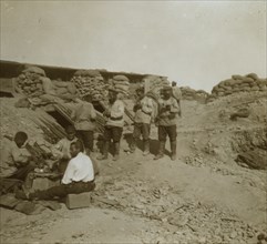 A soldier-cobbler mending boots in a Russian redoubt  1905