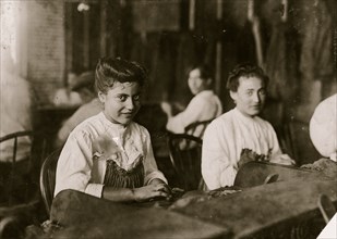 A Tampa, Fla., cigar maker adolescent. Many beautiful girls and women in the business. 1909