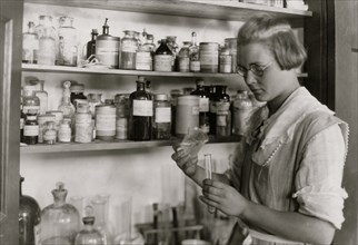 A Third year high school girl in the chemical laboratory, - Greenbank Consolidated School,  1921