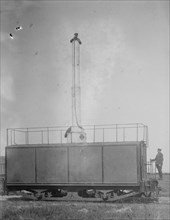 Train Carries a man 10 stories aloft on what looks like a Chimney