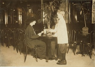 A young table boy in Newsome's ice cream parlor. 1914