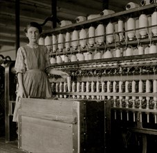 French illiterate works as a doffer or carder in a mill; she is 14 or 15 years old. 1911