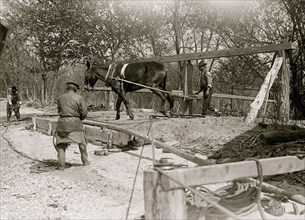 African American drilling a well with a horse on a turnstile 1914