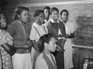 African American in Music class practicing songs for May Day-Health Day festivities. Flint River Farms, Georgia 1939