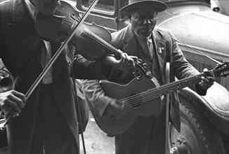 African American musicians play a violin  Guitar 1939