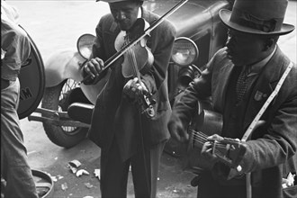 African American musicians play a violin  Guitar 1939