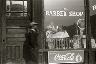 African American outside Barber shop in the Black Belt, Chicago, Illinois 1941