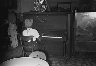 African American Piano Player at the Wonder Bar, hot spot in Circleville, Ohio  1935