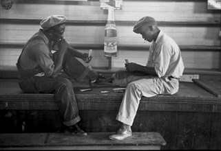 African American Playing cards on a bench 1938