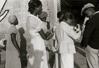 African American Residents of Amite City, Louisiana on their way to church 1935