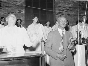 African American Singing at a Pentecostal church. Chicago, Illinois 1941