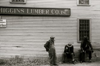 African American sit by the side of  Lumberyard in Provincetown, Mass. 1940