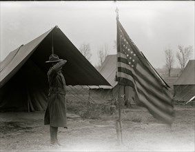 African American Soldier salutes the flag 1917