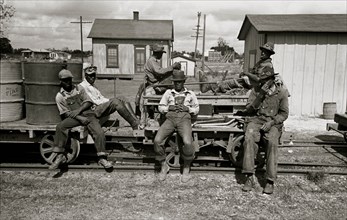 African American take a break from their work on the railroad 1938