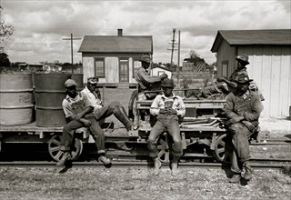 African American take a break from their work on the railroad 1938