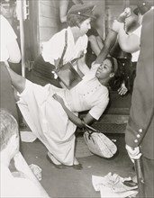 African American woman being carried to police patrol wagon  1963