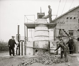 African American worker on Machine for extracting acid from phosphate 1920